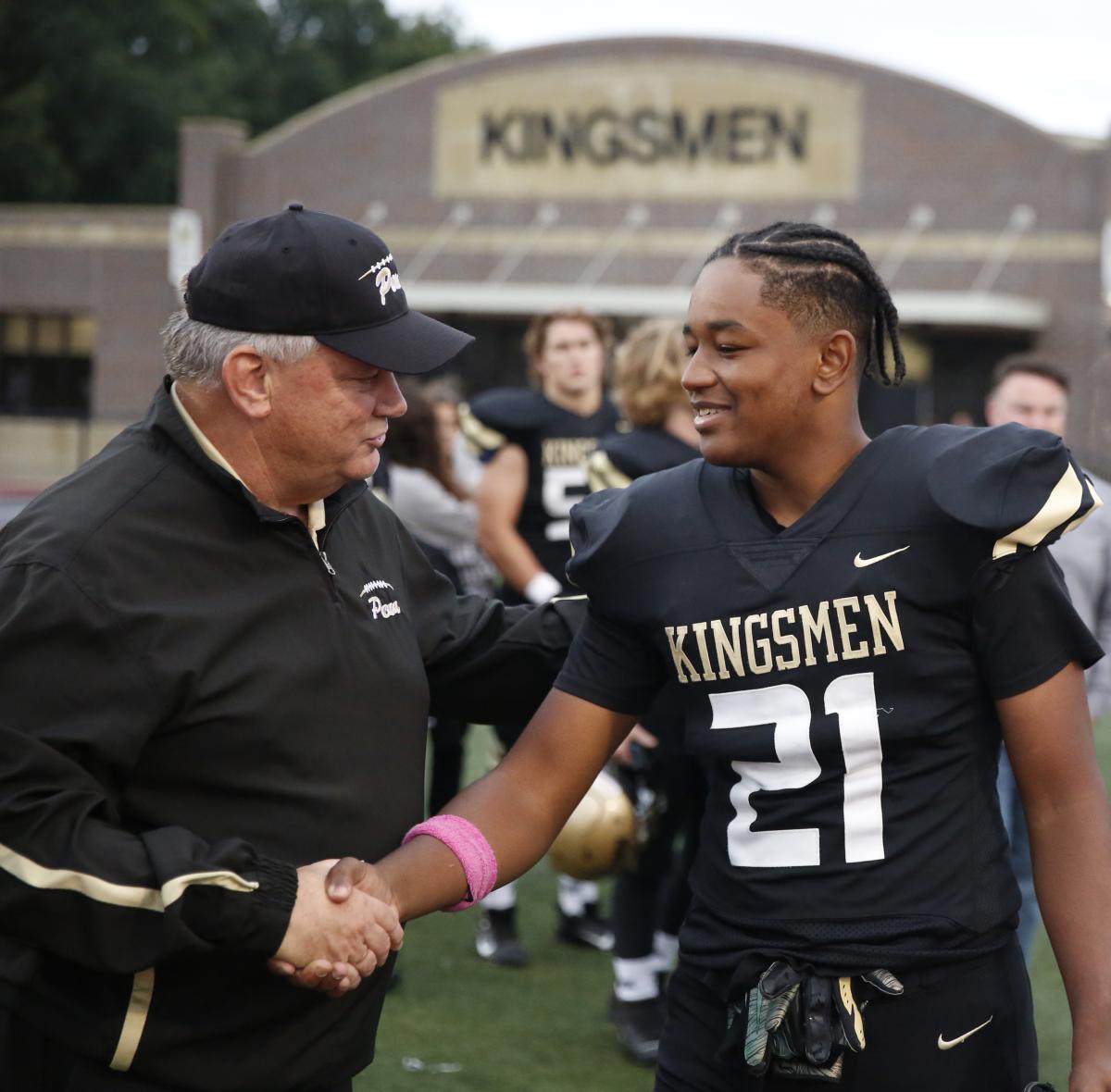 Coach Yeoman with Kingsmen player