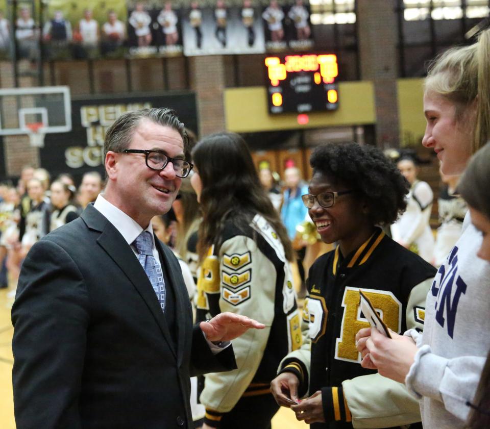 P-H-M School Board Pres. Chris Riley hands out Academic Letters in a ceremony Feb. 5, 2019