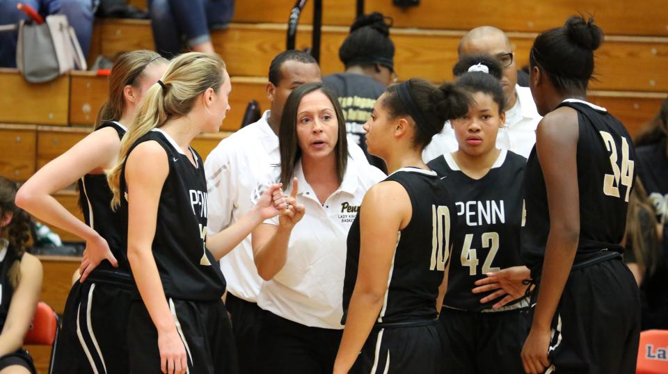 Boys in basketball uniforms receiving instruction from coach Free Photo  Download