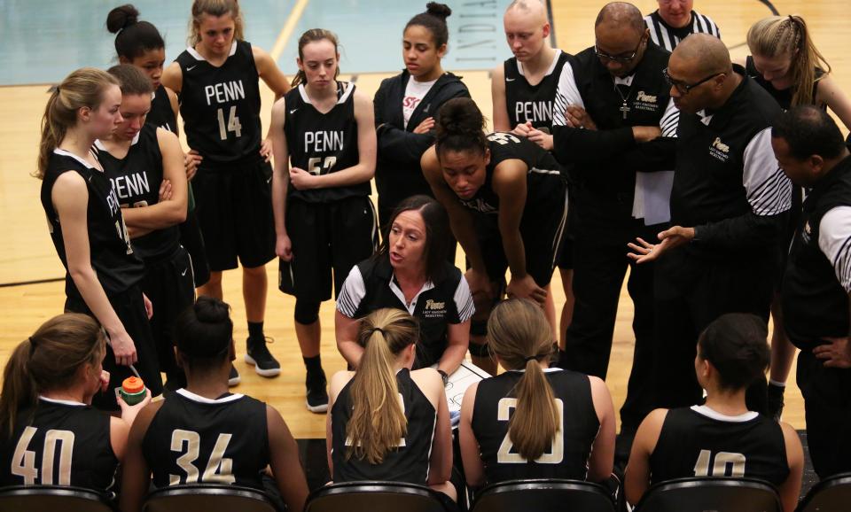 Penn Coach Kristi Ulrich with the Penn Girls Basketball team