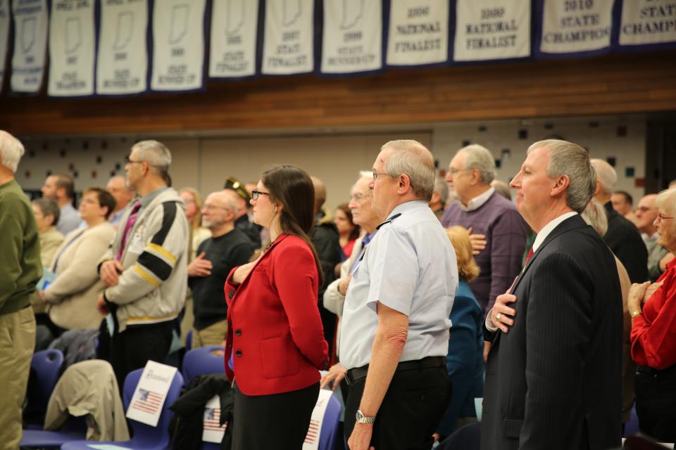 Schmucker Principal Mrs. Dean-Null, Maj. Gen. Peter Sullivan & Supt. Dr. Thacker stand for the National Anthem