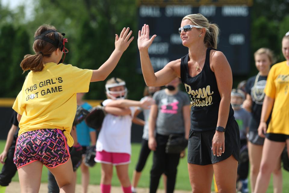 Penn Softball Coach Beth Zachary instructs campers