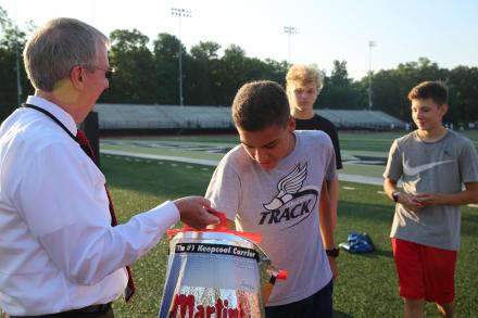 Dr. Thacker handing out popsicles