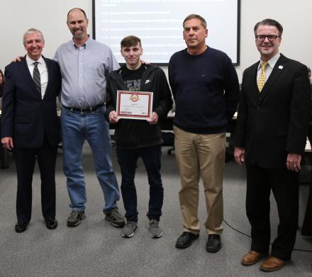 Penn-Harris-Madison Supt. Dr. Jerry Thacker, Paul Anderson, Heartsaver Hero Award recipient Logan Hill, Penn Health instructor Rod Pawlik, and P-H-M Board of School Trustees President Chris Riley.