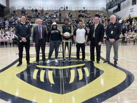 Markus Burton recognized before the Jan. 24 home game​ with his parents and Penn Principal Sean Galiher, PHM Superintendent Dr. Jerry Thacker, Penn Basketball Coach Al Rhodes, & Penn Athletic Director Jeff Hart
