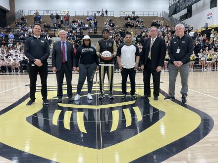 Markus Burton recognized before the Jan. 24 home game with his parents and Penn Principal Sean Galiher, PHM Superintendent Dr. Jerry Thacker, Penn Basketball Coach Al Rhodes, & Penn Athletic Director Jeff Hart