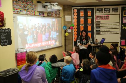 Mrs. Lindsay Helman's 4th grade class watching a Mustang Gives Back video