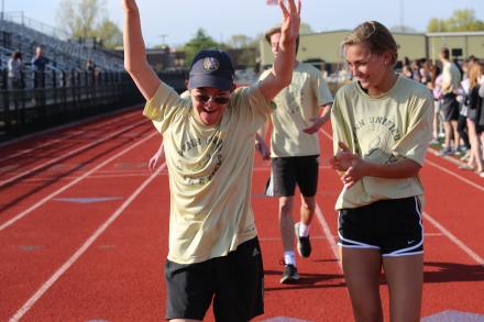 students rejoice after finishing a race