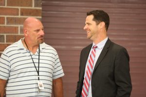 Penn Principal Sean Galiher talks with new Penn Resource Teacher Dane Whipple