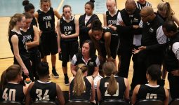 Penn Coach Kristi Ulrich with the Penn Girls Basketball team