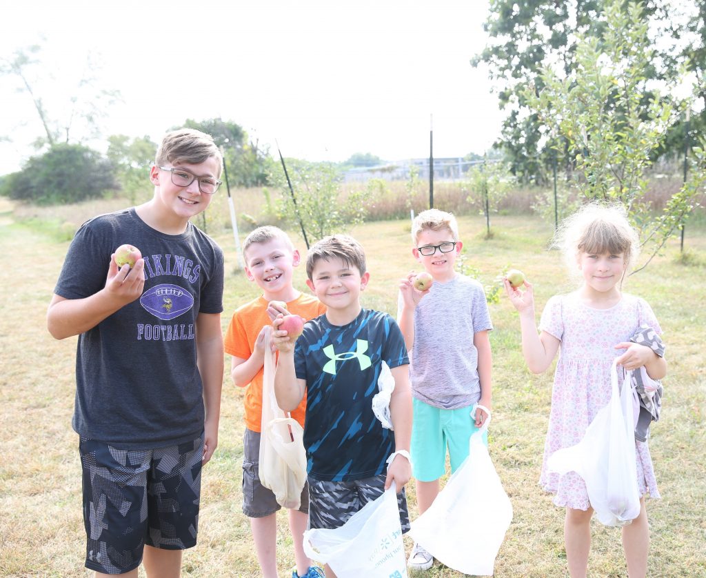 Horizon students with Discovery student who helped plant the orchard