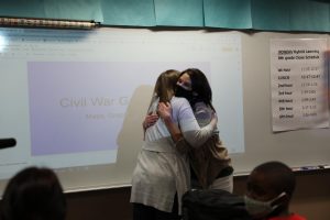 Ms. Allison Marsh gives Mrs. Schuster a congratulatory hug