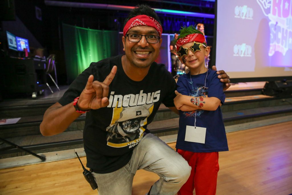 Teacher and student dressed like rock stars