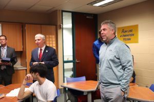 men talking in a classroom