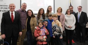 Impact Award winners with their families