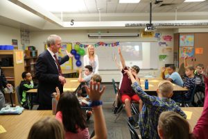 Dr. Jerry Thacker with Elm Road students in classroom (2019)