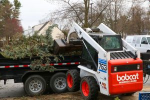 Bobcat moving storm debris