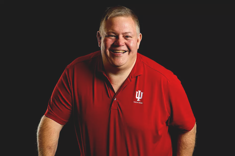 Man in red IU shirt smiling