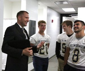 Dr. Aaron Leniski talking to Penn football players