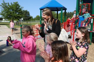 Dr. Heather Short with elementary school students