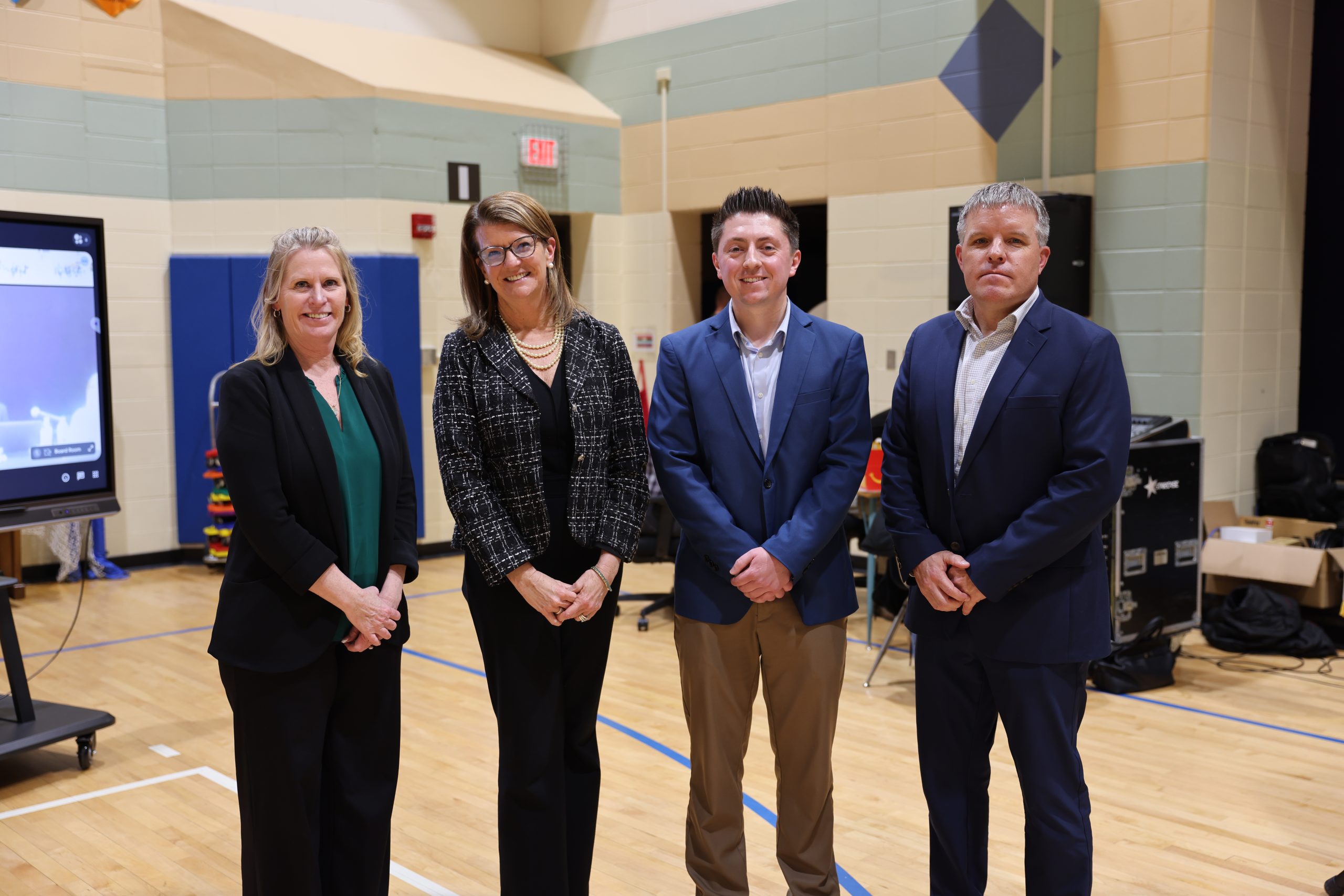Schafer Gear Works representatives Kelly Lowry and Alex Beagles pictured with Superintendent Dr. Heather Short and Vice President Ryan McCullough after the PHM School Board approved renaming Penn High School Robotics Lab the Schafer Gearworks Robotics Lab as part of the PHMEF Naming Rights Campaign