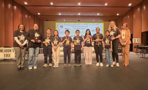 People standing on stage at an event.