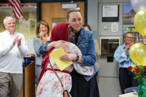 Kelly Watts hugs student after winning P-H-M 2026 Secondary Teacher of the Year 