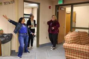 Principal Lorraine White surprises Carly Taylor when she walks into the Northpoint school library