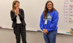 Dr. Heather Short claps and congratulates Josie Engdahl after surprising her with the news that she's PHM's 2026 Elementary Teacher of the Year