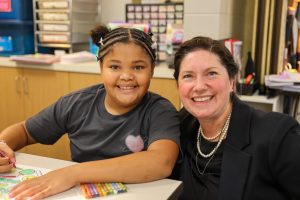 Asst. Superintendent Dr. Lavon Dean-Null with Mary Frank Elementary School female student on the first day of school