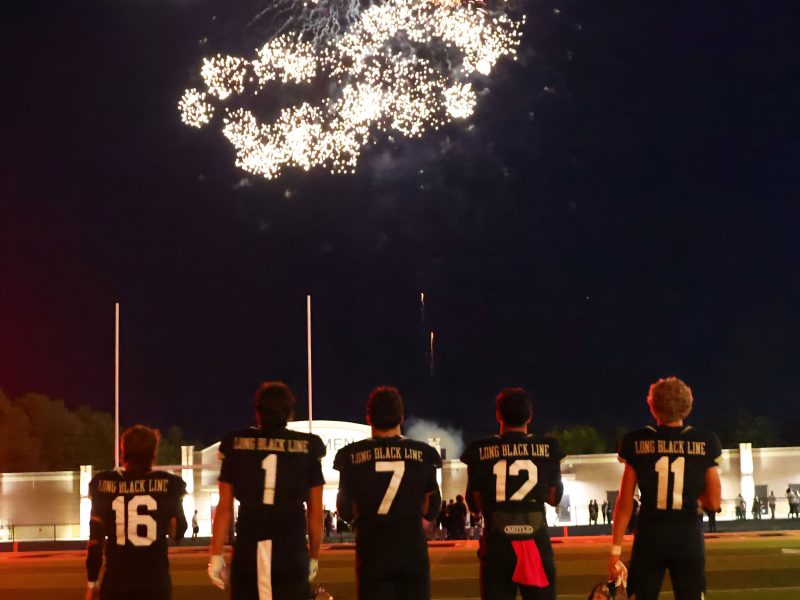 Penn football players watching fireworks