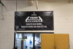 Banner advertising Schafer Gear Works, a manufacturer of robotics equipment.